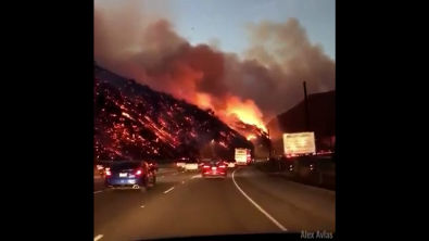 Dash cam footage shows a massive wildfire raging near Bel-Air, California